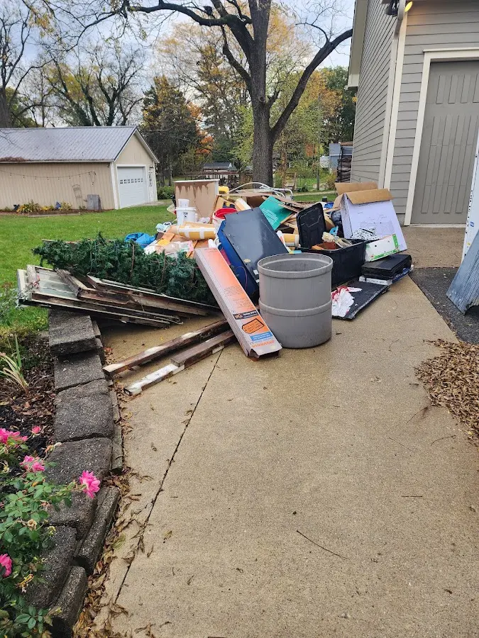 Dumpster being loaded with debris for 30 Yard Dumpster Rental in Lower Makefield